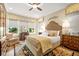 Comfortable bedroom with large windows, decorative headboard and patterned area rug at 105 Harbor Trace Ln, Summerville, SC 29486