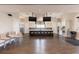 Large community kitchen with stainless steel appliances, an island bar, cabinets, and hardwood floors for gatherings at 105 Harbor Trace Ln, Summerville, SC 29486