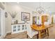 Dining room featuring wood flooring, a wood table, and decorative lighting at 105 Harbor Trace Ln, Summerville, SC 29486