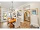 Dining room with wood table, chandelier, and view to the outdoor space at 105 Harbor Trace Ln, Summerville, SC 29486