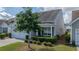 Beautifully landscaped front yard and a two-car garage on this lovely home at 105 Harbor Trace Ln, Summerville, SC 29486