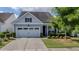 Charming home with a well-manicured front yard and an attached two-car garage at 105 Harbor Trace Ln, Summerville, SC 29486