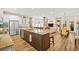 Open-concept kitchen with stainless steel appliances, granite countertops, and island seating at 105 Harbor Trace Ln, Summerville, SC 29486
