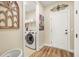 Bright laundry room with modern appliances, shelving and tile floors at 105 Harbor Trace Ln, Summerville, SC 29486