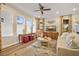 Living room with large windows, ceiling fan, and comfortable seating at 105 Harbor Trace Ln, Summerville, SC 29486