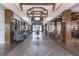 Elegant lobby with high ceilings, wood beams, stylish lighting, herringbone floors, and comfortable seating arrangements at 105 Harbor Trace Ln, Summerville, SC 29486