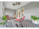 A beautifully decorated screened-in patio with comfortable seating and stylish decor elements at 105 Harbor Trace Ln, Summerville, SC 29486