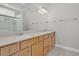 Bathroom featuring double vanity, quartz countertop, cabinetry, mirrors, and shower at 109 Billowing Sails St, Summerville, SC 29486