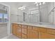 Bright bathroom featuring a double sink vanity with updated hardware and large mirror at 109 Billowing Sails St, Summerville, SC 29486
