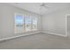 Bright bedroom with lake view, carpet, and neutral walls with a ceiling fan at 109 Billowing Sails St, Summerville, SC 29486