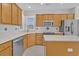 Spacious kitchen features stainless steel appliances, an island, and a tile backsplash at 109 Billowing Sails St, Summerville, SC 29486