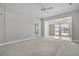 Airy living room with modern lighting, easy access to other rooms, and a glimpse of the outdoor scenery at 109 Billowing Sails St, Summerville, SC 29486