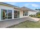 Brick patio with retractable awning and slider door to the home's interior at 109 Billowing Sails St, Summerville, SC 29486
