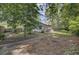Spacious backyard with scattered brick walkways and mature trees at 109 Salem Ct, Summerville, SC 29486