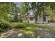 A spacious backyard with mature trees, lush vegetation, and partial fencing at 109 Salem Ct, Summerville, SC 29486