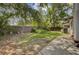 A verdant backyard space with mature trees, lush vegetation, and a partially fenced perimeter at 109 Salem Ct, Summerville, SC 29486