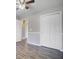 Bedroom featuring wood-look flooring, a double closet, and a view to another room at 109 Salem Ct, Summerville, SC 29486
