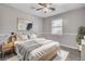 Relaxing bedroom featuring neutral tones, a ceiling fan, and a large window for ample light at 109 Salem Ct, Summerville, SC 29486