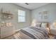 Cozy bedroom with natural light from the window, neutral decor, and stylish furnishings at 109 Salem Ct, Summerville, SC 29486