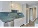 Well-lit kitchen with ample storage, featuring white cabinetry and stainless steel appliances at 109 Salem Ct, Summerville, SC 29486