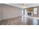 Spacious living room highlighted by a stone fireplace, hardwood flooring, and a walk-out at 109 Salem Ct, Summerville, SC 29486