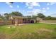 Expansive backyard with covered patio, perfect for outdoor gatherings and relaxation at 114 Stewart St, Goose Creek, SC 29445