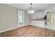 Bright dining area featuring wood floors and a view of the backyard at 114 Stewart St, Goose Creek, SC 29445