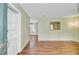 Open-concept living area with wood floors and neutral wall color at 114 Stewart St, Goose Creek, SC 29445