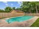 Private backyard pool area with wooden fence and lush greenery at 114 Stewart St, Goose Creek, SC 29445