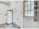 Utility room includes a water heater and a door to access the outside of the property at 114 Stewart St, Goose Creek, SC 29445