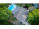 Aerial view of home with pool, lush yard, updated roof, and mature trees at 1145 Bellwood Rd, Charleston, SC 29412