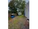 A backyard with a shed, two kayaks, and a wooden fence at 1145 Bellwood Rd, Charleston, SC 29412