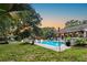 Spacious backyard featuring a pool, hammock, and outdoor seating, creating an inviting oasis at 1145 Bellwood Rd, Charleston, SC 29412