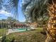 Secluded backyard pool with lounge chairs, hammock, string lights, and easy access to home at 1145 Bellwood Rd, Charleston, SC 29412