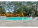 Sparkling pool features a travertine deck, sunshelf with loungers, and string lights for evening swims at 1145 Bellwood Rd, Charleston, SC 29412