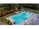Stunning pool area with sun shelf, loungers, hammock, string lights, and tropical plants at 1145 Bellwood Rd, Charleston, SC 29412