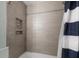 Beautiful bathroom with modern shower, stylish neutral tile, and built-in shelf niche at 1145 Bellwood Rd, Charleston, SC 29412