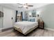 Cozy bedroom features bright paint, ceiling fan, and a charming mirror detail at 1145 Bellwood Rd, Charleston, SC 29412