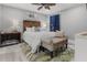Serene bedroom features a ceiling fan, wooden headboard and a bench at the foot of the bed at 1145 Bellwood Rd, Charleston, SC 29412