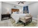 Serene bedroom features a ceiling fan, wooden headboard and a bench at the foot of the bed at 1145 Bellwood Rd, Charleston, SC 29412