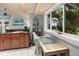 Comfortable dining area with a view of the lush tropical landscape offering a serene atmosphere at 1145 Bellwood Rd, Charleston, SC 29412