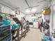 Organized garage space featuring laundry appliances, storage cabinets, and exercise equipment at 1145 Bellwood Rd, Charleston, SC 29412