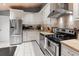 Bright kitchen featuring white cabinets, stainless steel appliances, and a patterned tile floor for added style at 1145 Bellwood Rd, Charleston, SC 29412