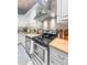 This kitchen has white cabinets, stainless steel appliances, wood countertops, and backsplash with tile design at 1145 Bellwood Rd, Charleston, SC 29412