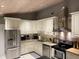 Well-lit kitchen with stainless steel appliances, granite countertops, and a beautiful wooden ceiling at 1145 Bellwood Rd, Charleston, SC 29412
