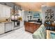 Open-concept kitchen with white cabinets, stainless steel appliances, and a dark kitchen island at 1145 Bellwood Rd, Charleston, SC 29412