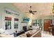 Cozy living room with vaulted ceilings, fireplace, and a ceiling fan at 1145 Bellwood Rd, Charleston, SC 29412