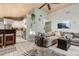 Open-concept living room and kitchen with hardwood floors, vaulted ceilings, and neutral decor at 1145 Bellwood Rd, Charleston, SC 29412
