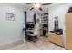 Well-lit office space with a built-in bookcase, ceiling fan, and hard surface floors at 1145 Bellwood Rd, Charleston, SC 29412