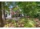 Beautiful condo with serene backyard setting, patio, and lush greenery at 115 Golfview Ln, Summerville, SC 29485